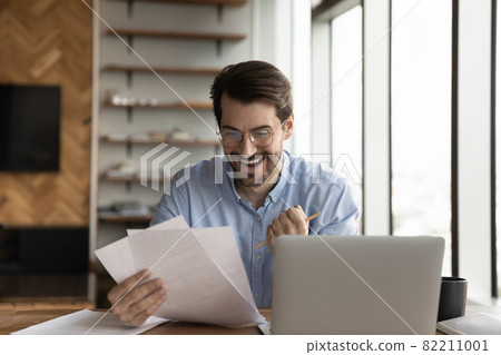 Excited Caucasian male employee triumph with promotion offer 82211001