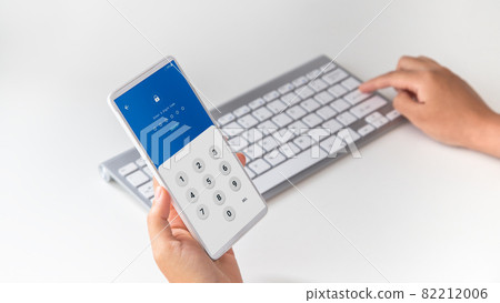 Woman hand enter password for the validation process, one time password, Mobile OTP secure Verification Method, 2-Step authentication web page. Woman hand enter password for the validation process, one time password, Mobile OTP secure Verification Method, 2-Step authentication web page. 82212006