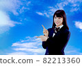 Schoolgirl pointing 82213360