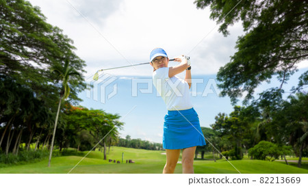 Golfer sport course golf ball fairway. People lifestyle woman playing game golf tee of blue sky background. Golfer sport course golf ball fairway. People lifestyle woman playing game golf tee of blue sky background. 82213669