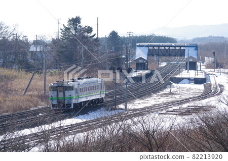 Single train departing from Kunnui Station on the Hakodate Main Line Single train departing from Kunnui Station on the Hakodate Main Line 82213920