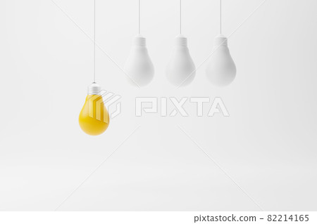 Hanging light bulb yellow outstanding among lightbulb group 82214165