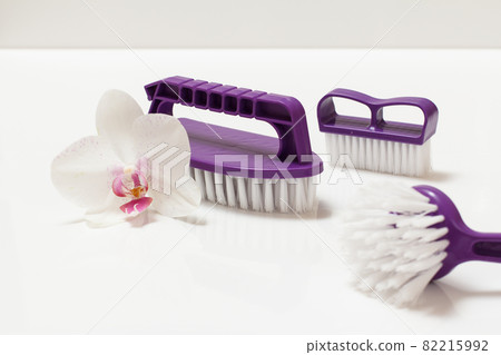 Plastic brushes for cleaning on white background. 82215992