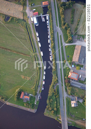 Agricultural landscape of Friesland, one of the northern provinces of the Netherlands - Friesland from above - Small harbour Agricultural landscape of Friesland, one of the northern provinces of the Netherlands - Friesland from above - Small harbour 82218031