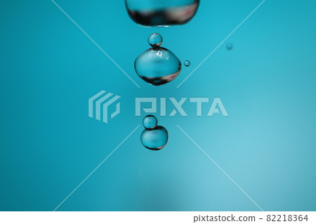 A large half of tap water taken with a macro lens, two combined water droplets, and two small water droplets A large half of tap water taken with a macro lens, two combined water droplets, and two small water droplets 82218364