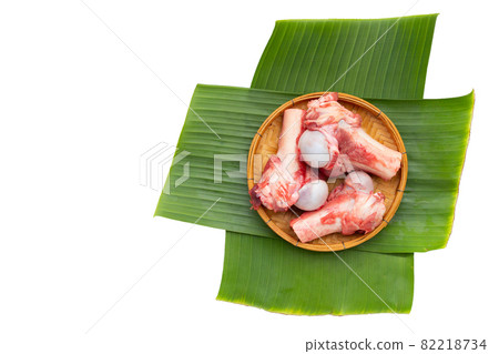 Raw pork bones in bamboo basket on banana leaves 82218734