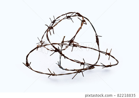 Rusty barb wire isolated on white background Rusty barb wire isolated on white background 82218835