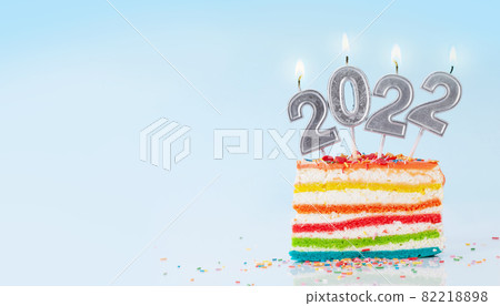 Christmas cake with number 2022 burning candles 82218898