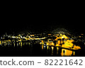 Night harbor and illuminated cityscape 82221642