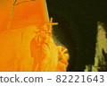 An icon holding a cross on a street corner 82221643