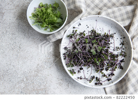 Assortment of micro greens on wooden table Assortment of micro greens on wooden table 82222450
