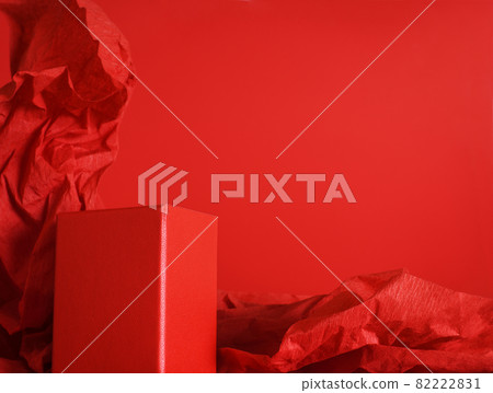 Empty red rectangular podium on red background with crumpled paper Empty red rectangular podium on red background with crumpled paper 82222831