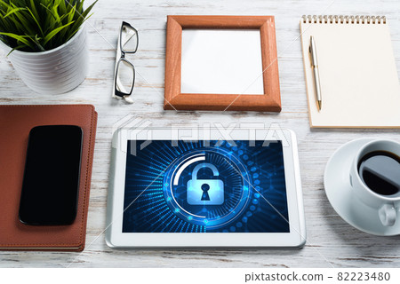 Web security and technology concept with tablet pc on wooden table 82223480