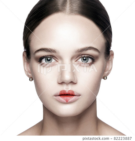 Portrait of beautiful woman with makeup and red heart shape on her lips. valentines day and beauty love and care concept. 82223887