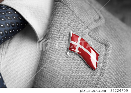 Metal badge with the flag of Denmark on a suit lapel Metal badge with the flag of Denmark on a suit lapel 82224709