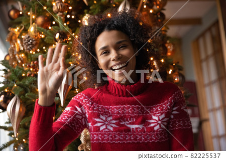 Portrait of smiling ethnic woman talk on video call 82225537