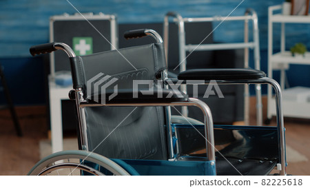Close up of wheelchair in empty nursing home at clinic. Close up of wheelchair in empty nursing home at clinic. 82225618