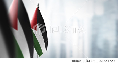 Small flags of Jordan on a blurry background of the city Small flags of Jordan on a blurry background of the city 82225728