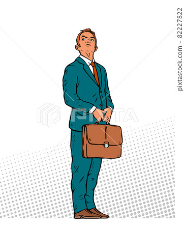 Young businessman stands with a briefcase in his hands Young businessman stands with a briefcase in his hands 82227822
