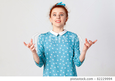 girl gesturing in full disbelief, shrugging her shoulders, having shocked expression girl gesturing in full disbelief, shrugging her shoulders, having shocked expression 82229994
