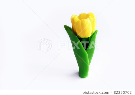 Yellow tulip made from soap isolated on white background. Handmade, closeup, copy space. Yellow tulip made from soap isolated on white background. Handmade, closeup, copy space. 82230702