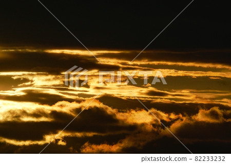 Early autumn morning sky, clouds illuminated by the morning sun Early autumn morning sky, clouds illuminated by the morning sun 82233232