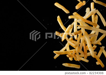 French fries scattered in the air 82234308