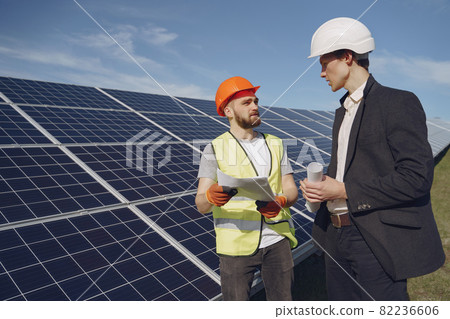 Foreman and businessman at solar energy station. 82236606