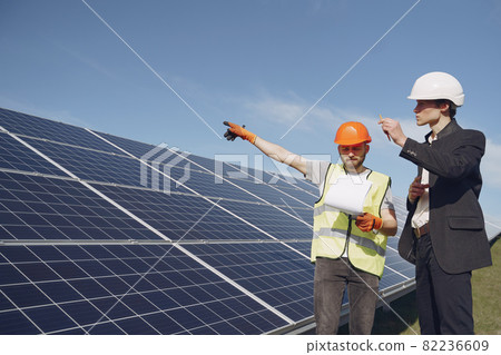 Foreman and businessman at solar energy station. 82236609