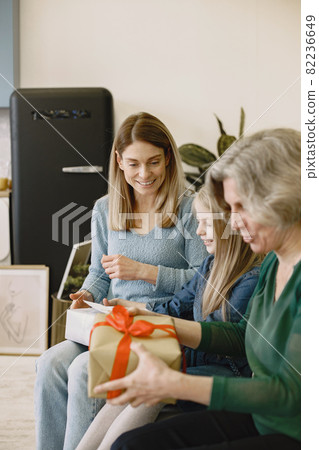 Family celebrating birthday in the kitchen Family celebrating birthday in the kitchen 82236649