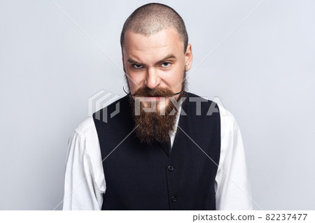 emotional man in suit on gray background 82237477