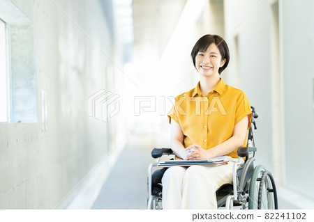 Female business woman in a wheelchair 82241102
