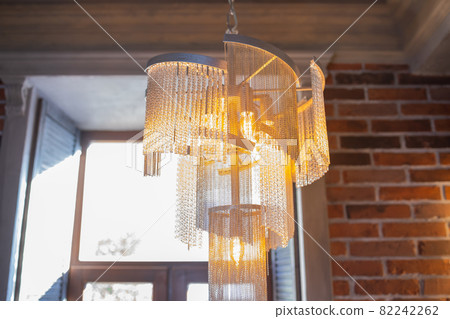 Chandelier background - Luxury crystal chandelier hanging from the ceiling indoors. Chandelier background - Luxury crystal chandelier hanging from the ceiling indoors. 82242262