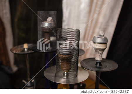part of the hookah, modern design, on a background. part of the hookah, modern design, on a background. 82242287