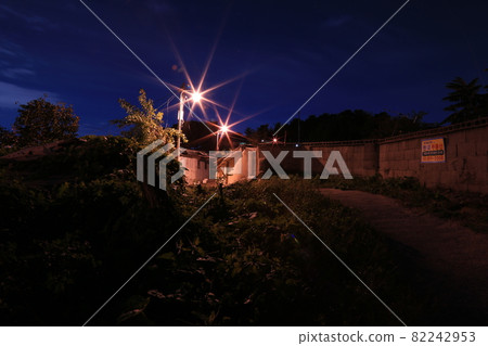 Evening. Light. Streetlight. Night view. Moon village. Alley Evening. Light. Streetlight. Night view. Moon village. Alley 82242953