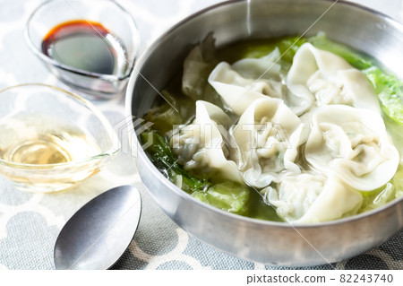 Handmade dumplings wrapped in a hat 82243740