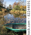 Boat floating on the waterside in autumn 82244691