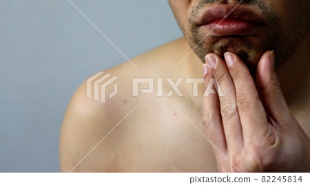 Close-up of a Japanese man suffering from a hairy beard Close-up of a Japanese man suffering from a hairy beard 82245814