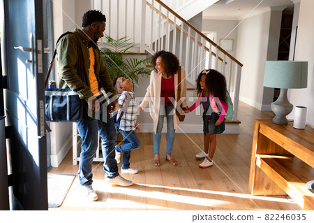 Happy african american family standing in hallway, returning back home 82246035