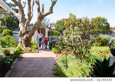 Happy caucasian family returning home after school and work Happy caucasian family returning home after school and work 82246425