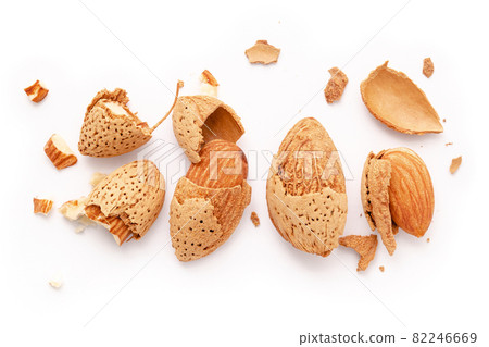 Close up group of almonds nut with shell  and cracked almonds shell isolated on white background. 82246669