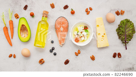 Ketogenic low carbs diet concept. Ingredients for healthy foods selection set up on white concrete background. Ketogenic low carbs diet concept. Ingredients for healthy foods selection set up on white concrete background. 82246690