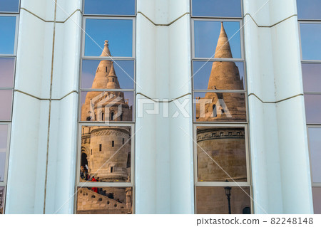 Matthias Church reflection. Fisherman bastion with details on the facade and the whole scene of the castle in Buda, Budapest Matthias Church reflection. Fisherman bastion with details on the facade and the whole scene of the castle in Buda, Budapest 82248148