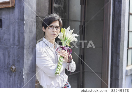 Young man with a bouquet 82249578