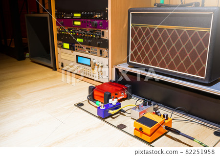 guitar pedal effect processor, amplifer, sound module and sampler in home recording studio. music background guitar pedal effect processor, amplifer, sound module and sampler in home recording studio. music background 82251958