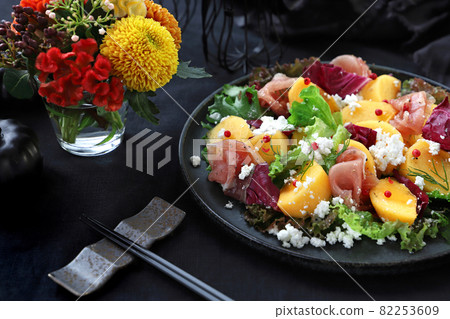 Autumn salad of persimmon and ham Autumn salad 82253609