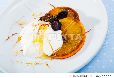 Caramel orange slices with berries and yogurt 82253667