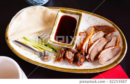 Peking duck with sauce and chinese pancakes 82253987