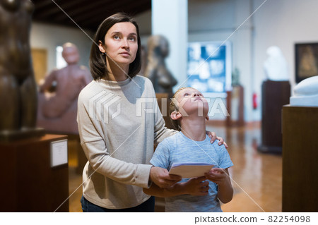 Woman and boy visiting museum 82254098