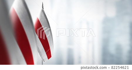 Small flags of Belarus on a blurry background of the city Small flags of Belarus on a blurry background of the city 82254621